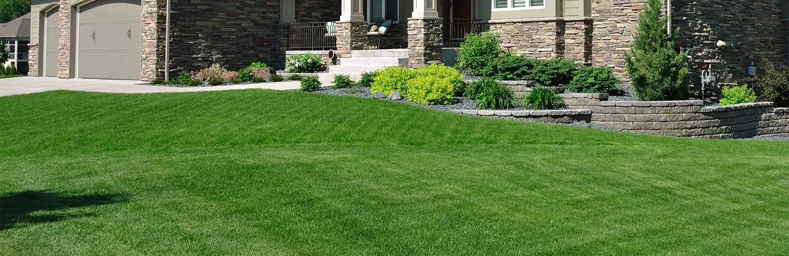 A green lawn serviced by Turf Workz